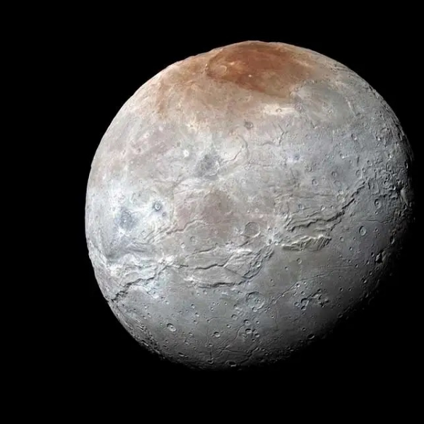 Pluto May Have Captured Its Biggest Moon After an Ancient Dance and Kiss