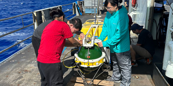 WashU grad student, Judy Zhang (right) steadying a seismic monitoring device before deployment (Photo: Doug Wiens)