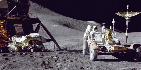 NASA image of Apollo 15 lunar module pilot Jim Irwin loading the lunar rover with tools and equipment.