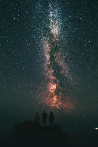 Image of 3 people looking at stars