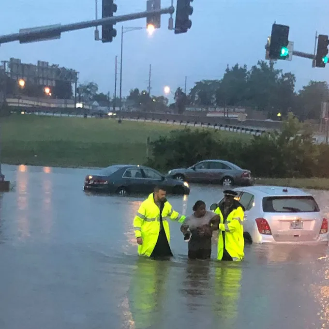 Two Jennings Precinct officers rescue a motorist from floodwaters in July 2022 in St. Louis. (Photo: St. Louis County Police Department)
