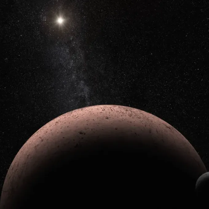 Boasting the most distant gas ever seen in our solar system, Makemake (illustrated) huddles with its moon in the frigid depths of space, beyond the orbits of Neptune and Pluto.  NASA, ESA, A. Parker/Southwest Research Institute