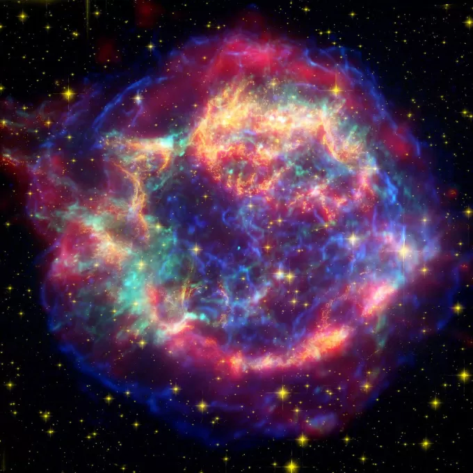 Cassiopeia A, a supernova remnant located 10,000 light years away in the constellation Cassiopeia, is the remnant of a once massive star that died in a violent explosion roughly 340 years ago. This image layers infrared, visible, and X-ray data to reveal filamentary structures of dust and gas. (Credit: NASA/JPL-Caltech/STScI/CXC/SAO)